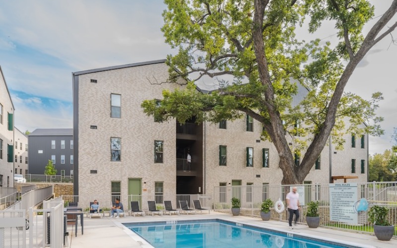 a swimming pool with seating around it